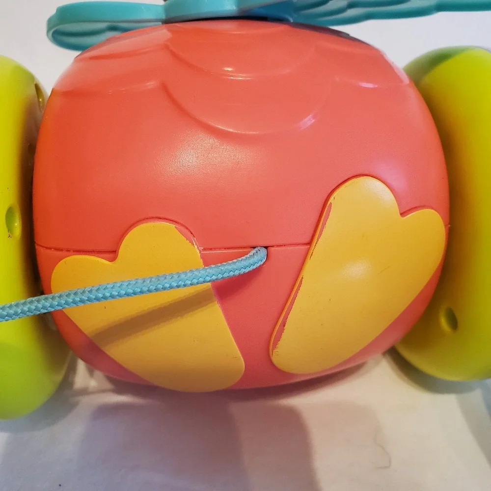 Fisher Price Paradise Pals Flamingo Roll A Round Rainbow Smile Face Pull Toys